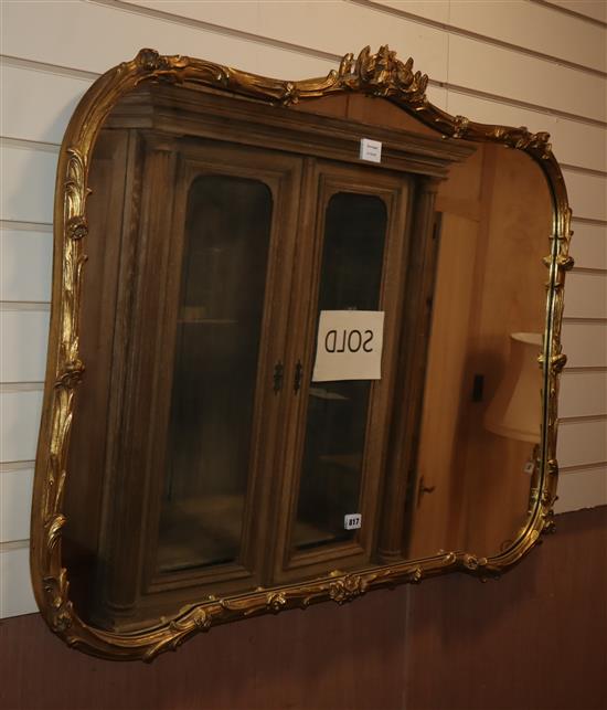 A large shaped rectangular gilt carved wood wall mirror W.110cm